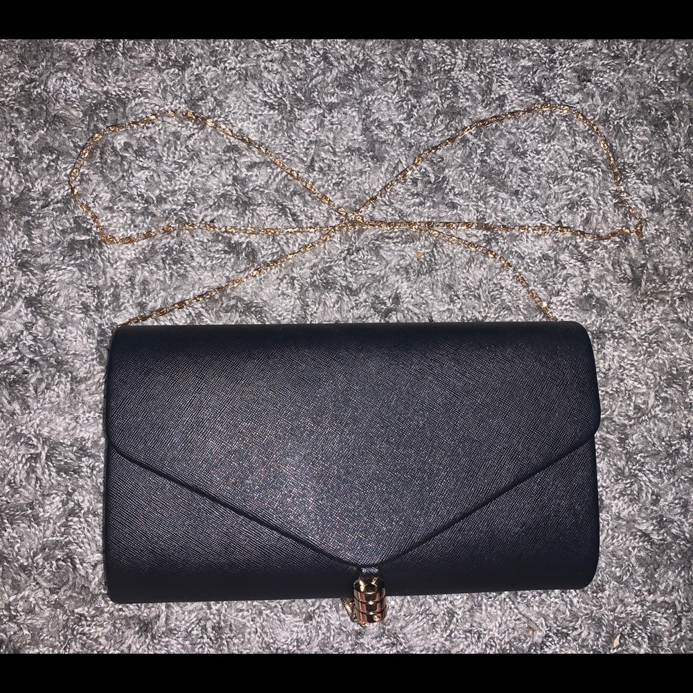 NWT ✨ Black clutch bag with gold accents